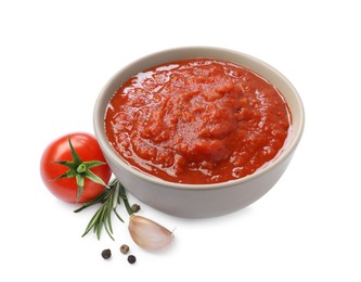 Photo of Homemade tomato sauce in bowl and fresh ingredients isolated on white