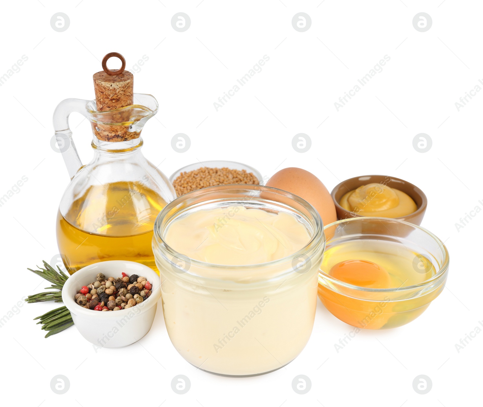 Photo of Delicious homemade mayonnaise, spices and ingredients on white background