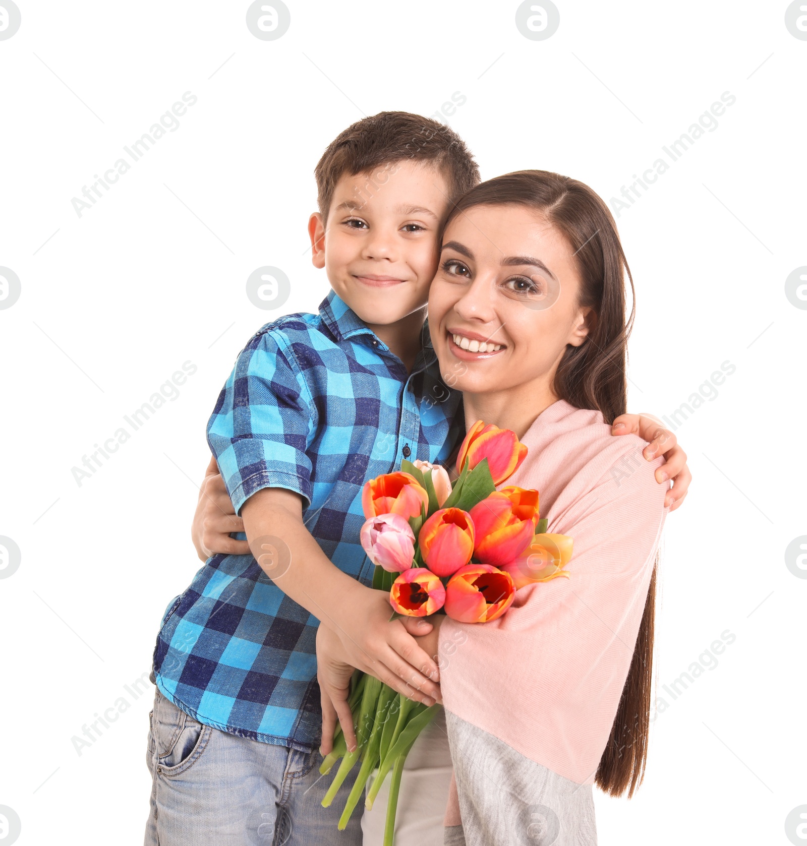 Photo of Portrait of happy woman with flowers and her son on white background. Mother's day celebration