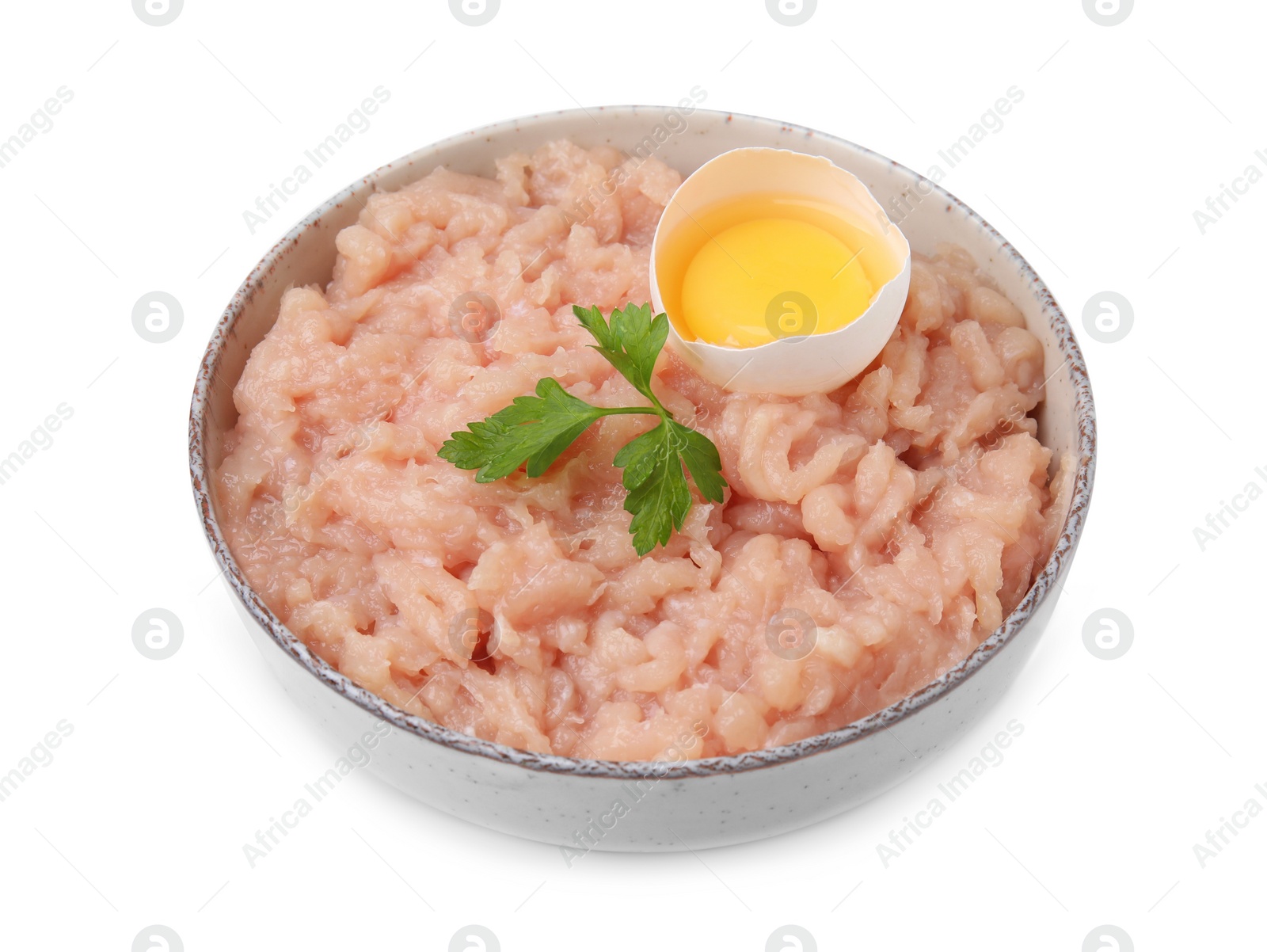 Photo of Fresh raw minced meat, parsley and egg in bowl isolated on white
