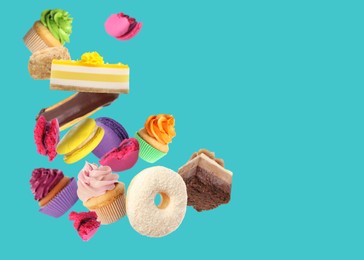 Image of Many different tasty desserts flying on light blue background. Space for text