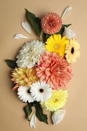 Photo of Flat lay composition with beautiful dahlia flowers on beige background