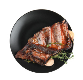 Photo of Tasty grilled ribs with thyme and garlic isolated on white, top view