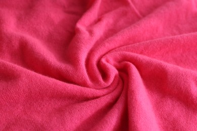 Photo of Beautiful pink fabric as background, closeup view