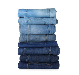 Photo of Stack of different jeans isolated on white