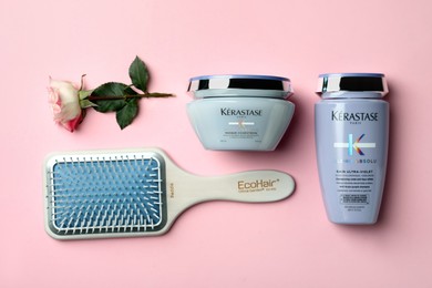 Photo of MYKOLAIV, UKRAINE - SEPTEMBER 07, 2021: Flat lay composition with Kerastase hair care cosmetic products on pink background