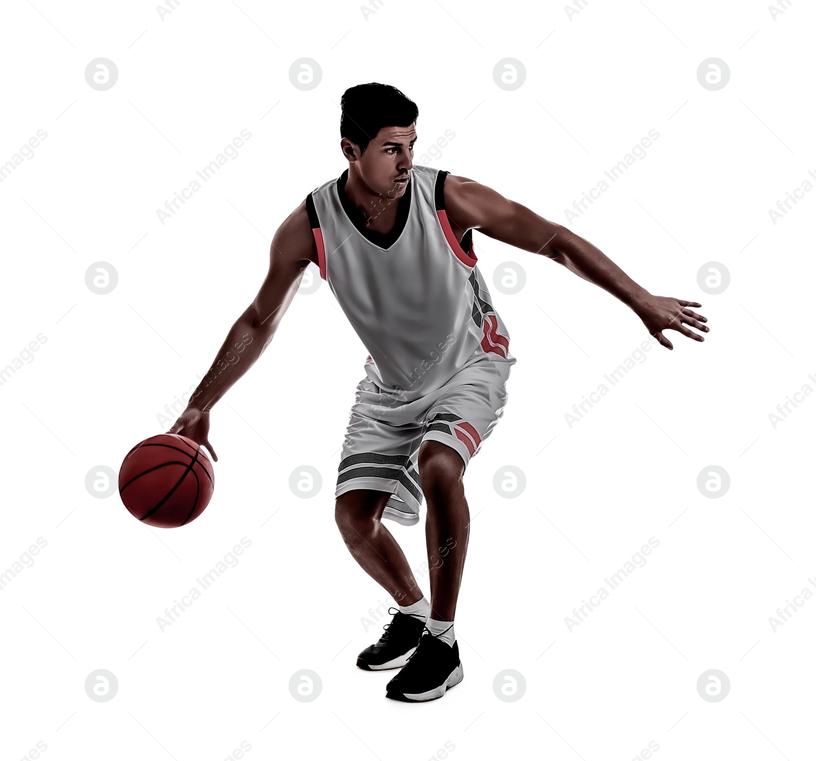 Image of Silhouette of professional sportsman playing basketball on white background