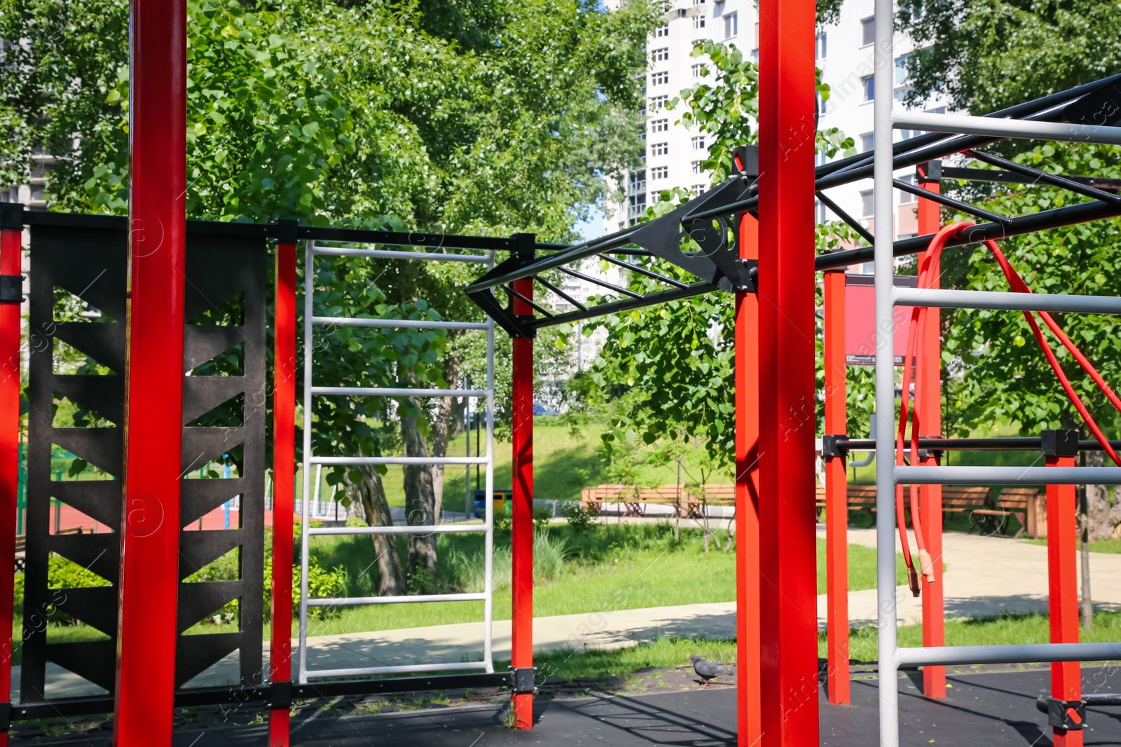 Photo of Empty outdoor gym with exercise equipment in park