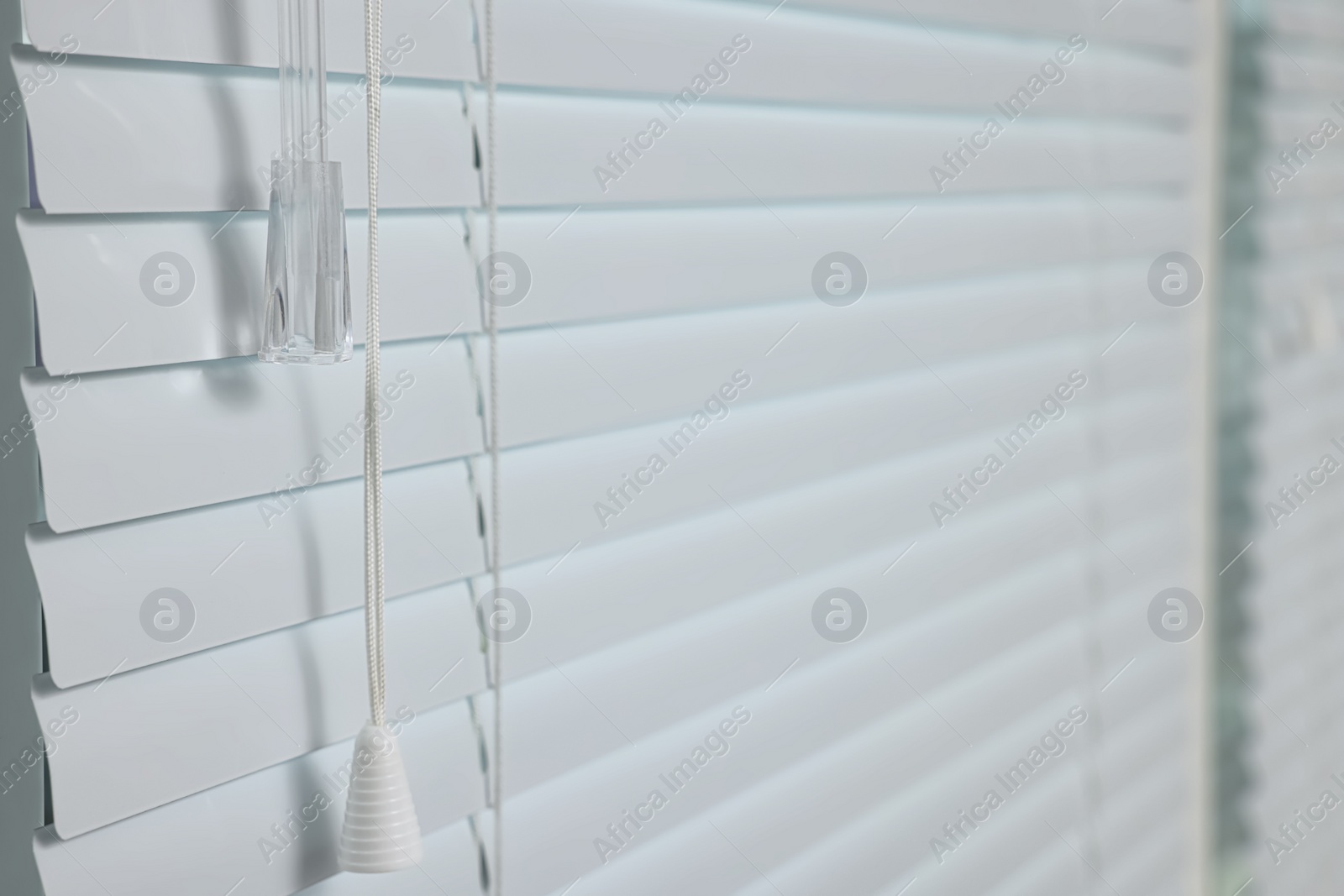 Photo of Closeup view of stylish horizontal window blinds