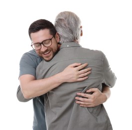 Happy son and his dad hugging on white background