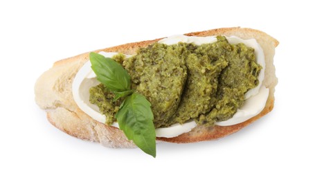 Photo of Tasty bruschetta with cream cheese, pesto sauce and fresh basil isolated on white, top view