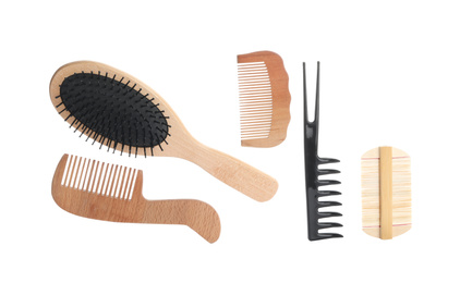 Set of professional hair combs and brush isolated on white, top view