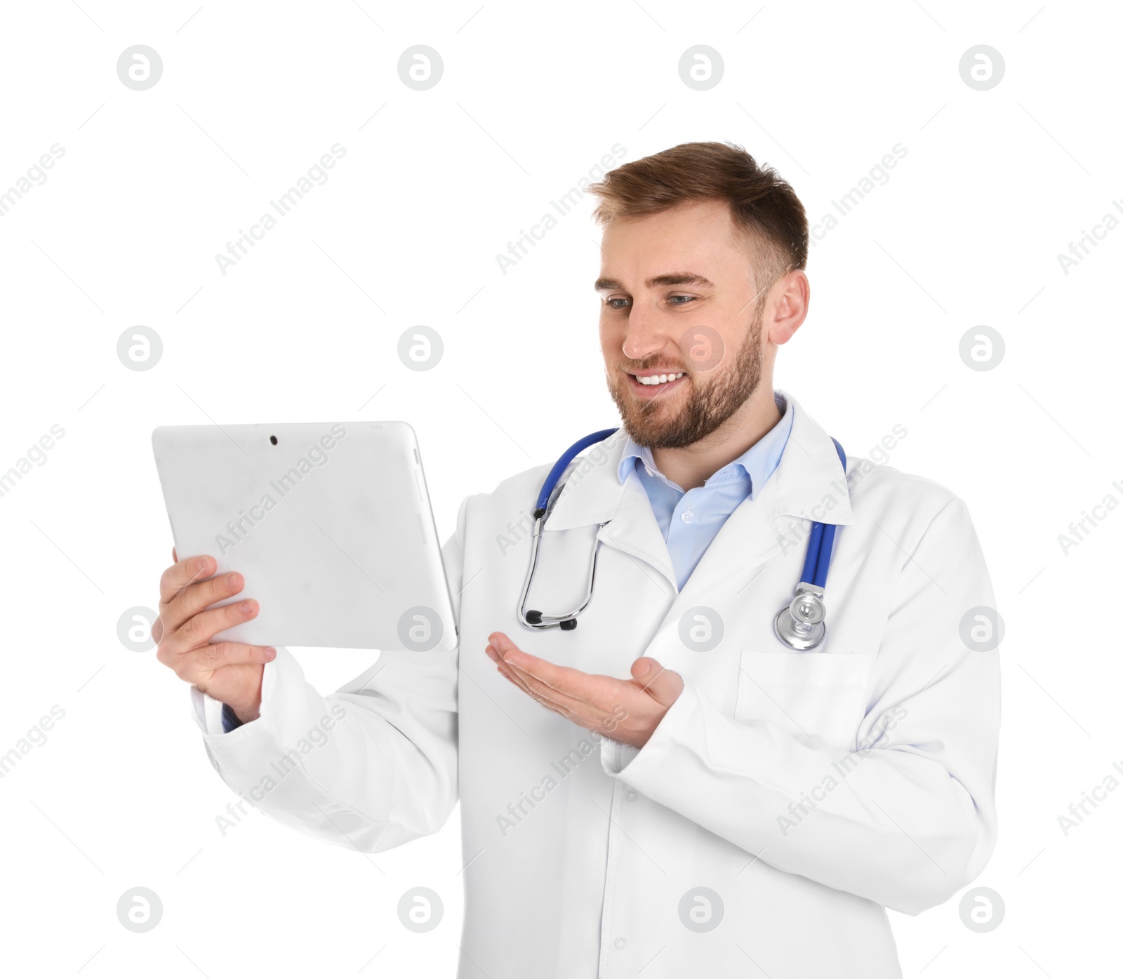 Photo of Male doctor using video chat on tablet against white background
