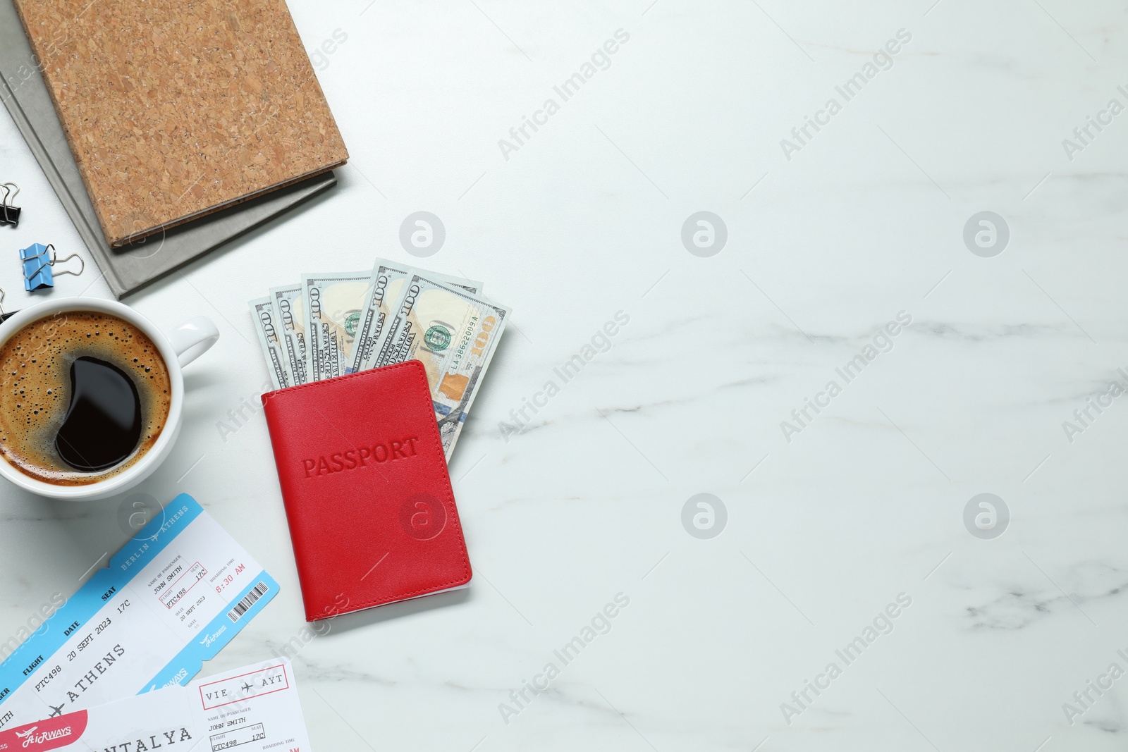 Photo of Flat lay composition with passport, dollars and tickets on white marble table, space for text. Business trip