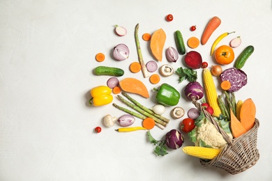 Flat lay composition with fresh vegetables on light background