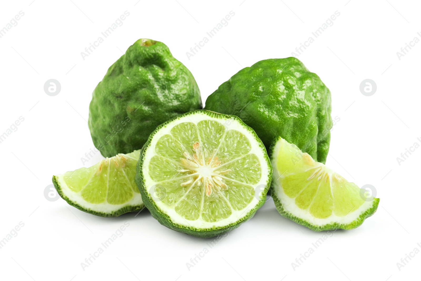 Photo of Whole and cut ripe bergamot fruits on white background