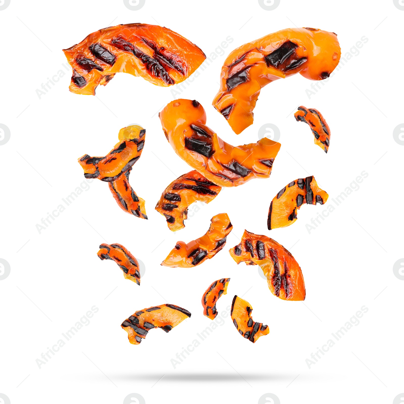 Image of Slices of grilled bell peppers in air on white background