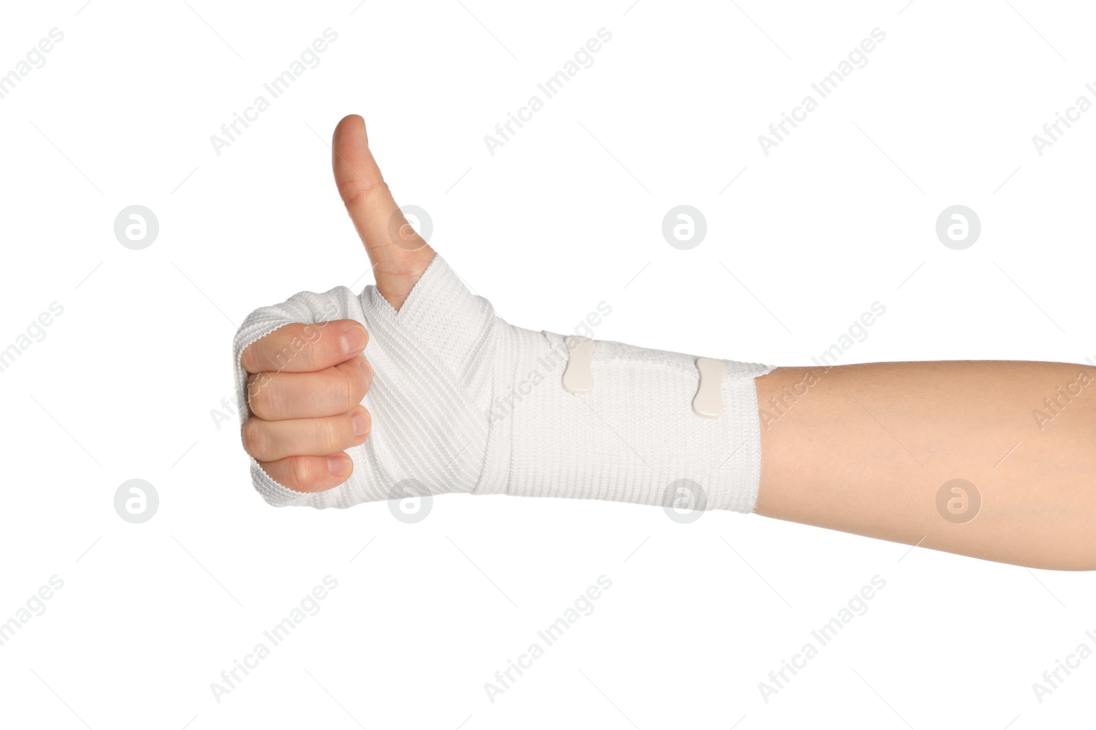 Photo of Woman with hand wrapped in medical bandage showing thumb up on white background, closeup