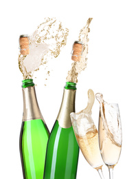 Image of Champagne splashing out of bottles and glasses on white background 