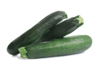 Fresh ripe green zucchinis isolated on white