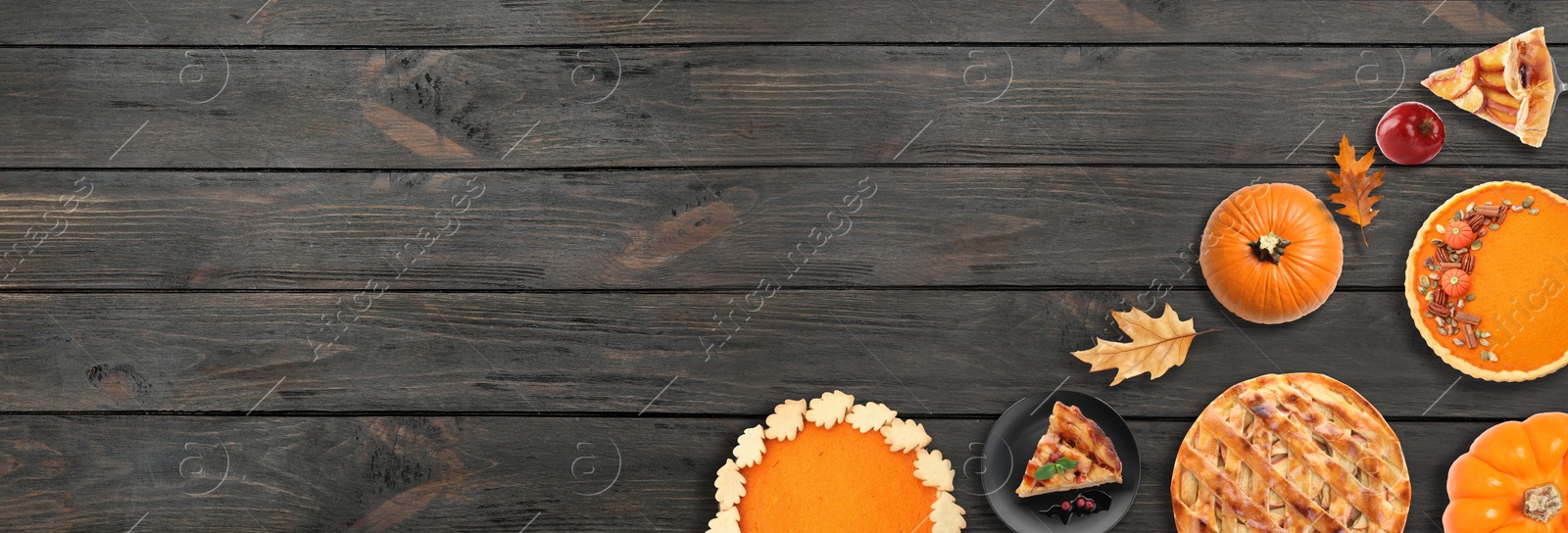 Image of Flat lay composition with different tasty pies on wooden table, space for text. Banner design