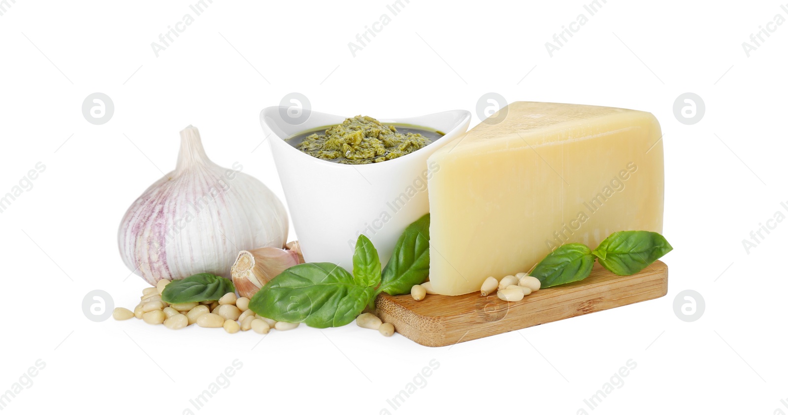 Photo of Tasty pesto sauce in bowl and ingredients on white background