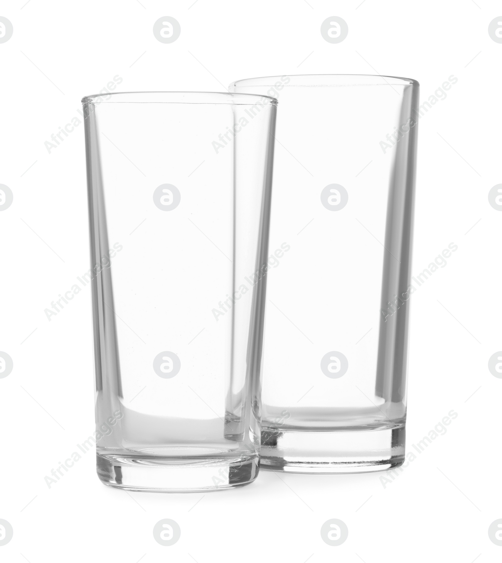 Photo of Two clean empty highball glasses isolated on white