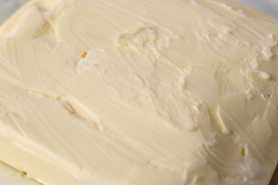 Piece of tasty homemade butter as background, closeup