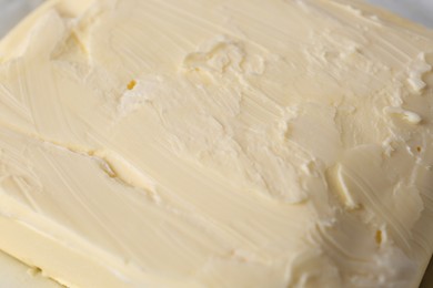 Photo of Piece of tasty homemade butter as background, closeup