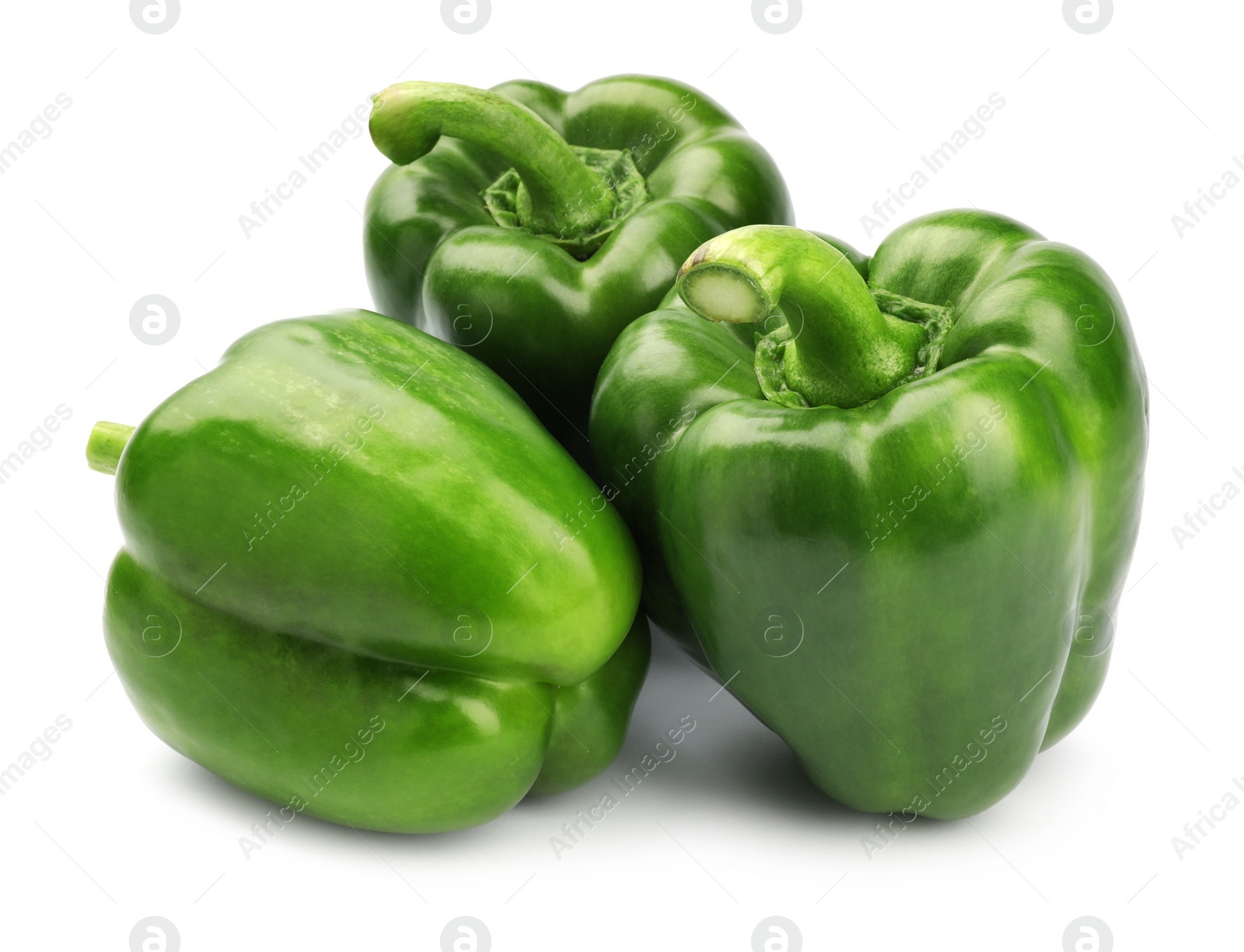 Photo of Ripe green bell peppers on white background