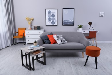 Photo of Stylish grey living room interior with comfortable sofa