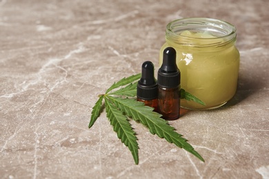 Photo of Composition with hemp lotion and space for text on grey background
