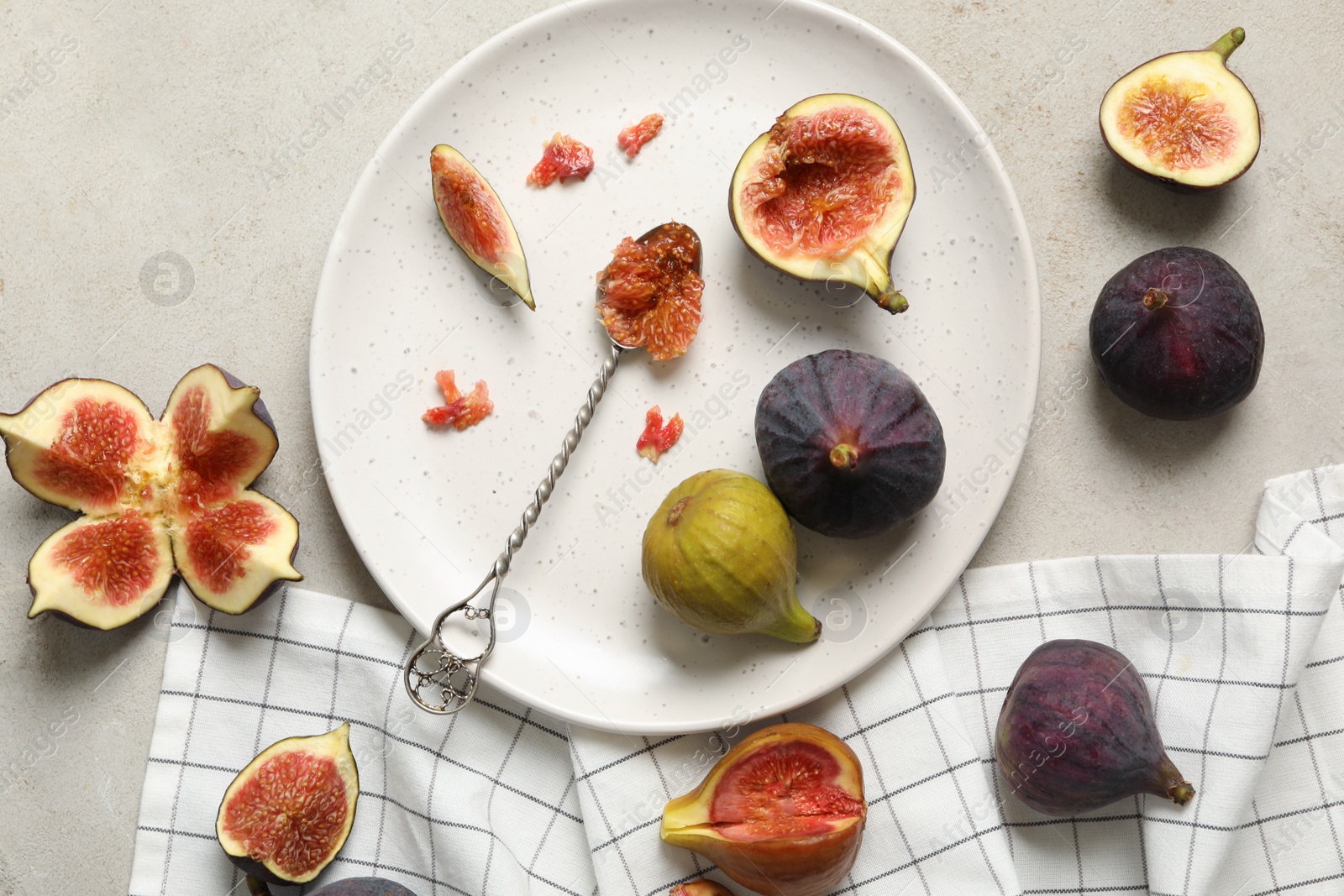 Photo of Flat lay composition with delicious figs on light grey table