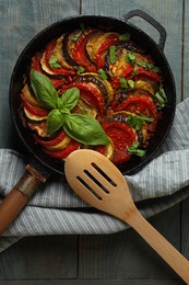 Delicious ratatouille on light blue wooden table, top view