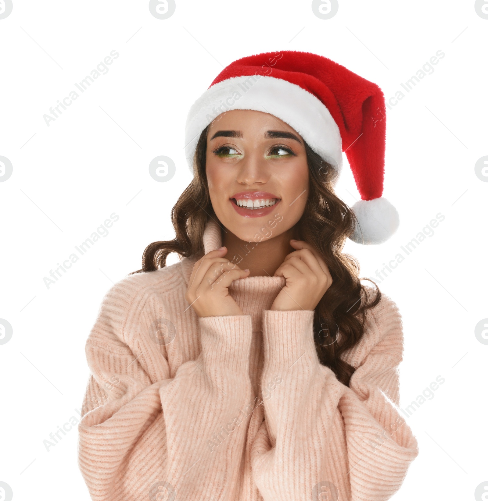 Photo of Beautiful young woman wearing warm sweater and Santa hat on white background. Christmas party
