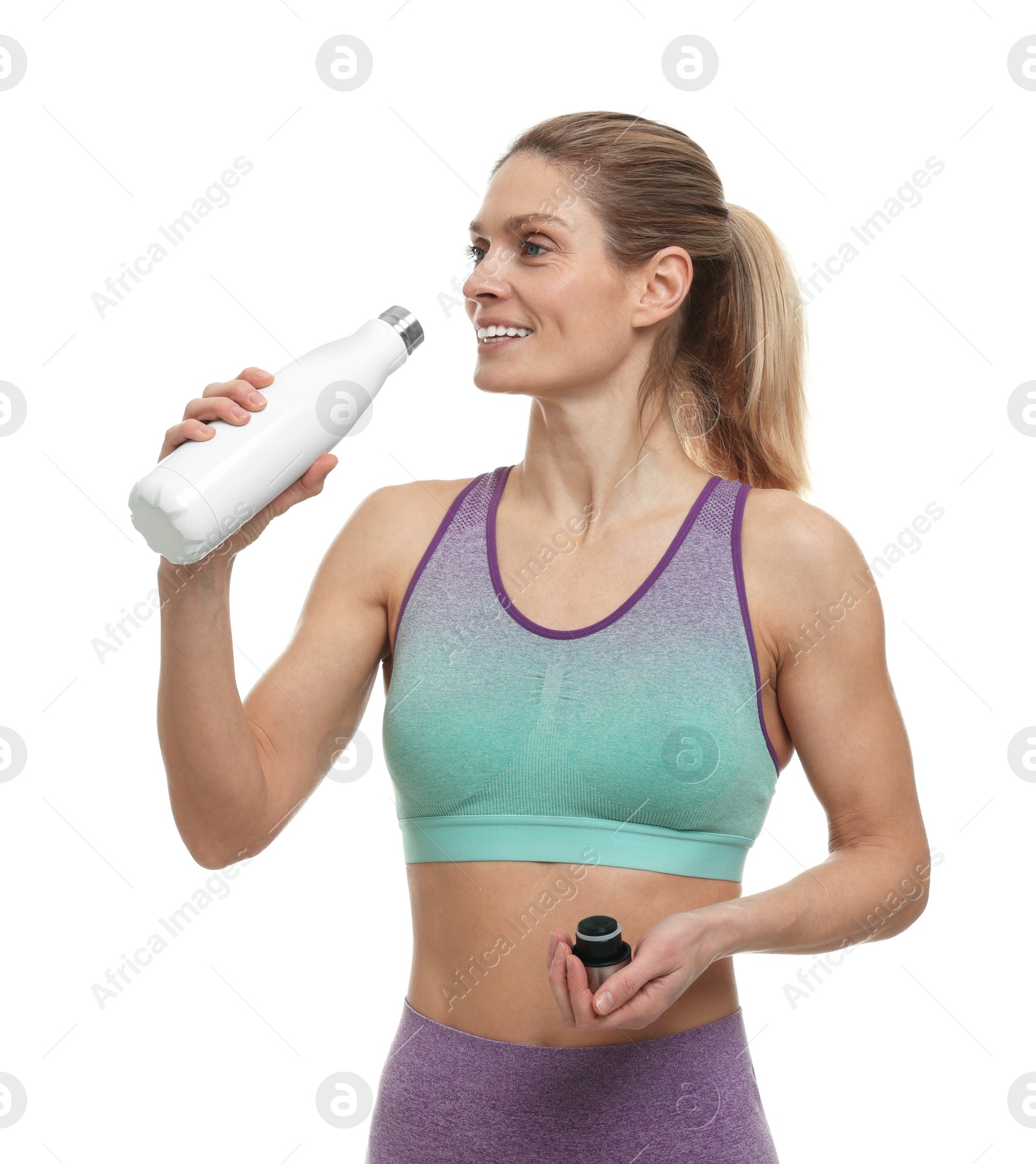 Photo of Portrait of sportswoman with thermo bottle on white background