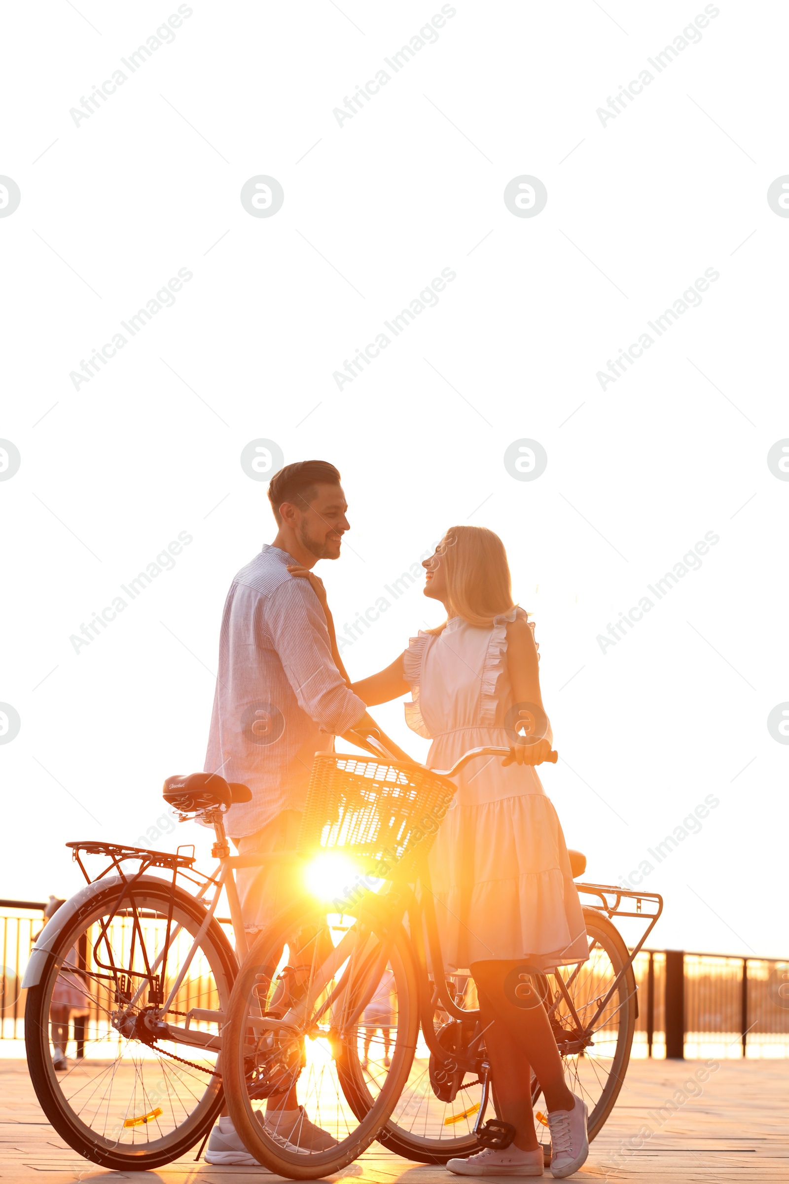 Photo of Happy couple with bicycles outdoors on summer day