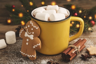 Composition with delicious marshmallow cocoa on wooden table