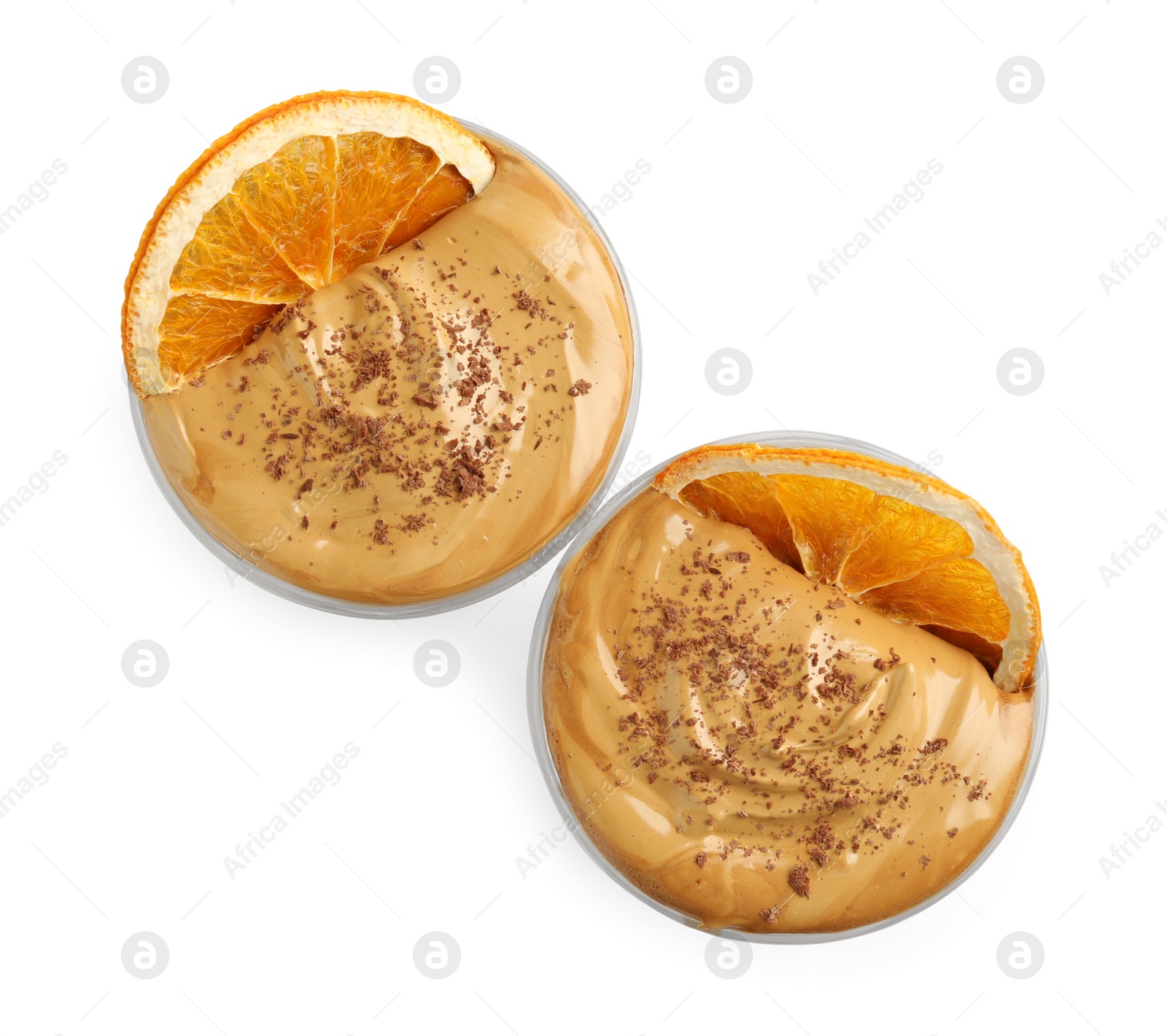 Photo of Glasses of delicious dalgona coffee with dry orange and chocolate isolated on white, top view