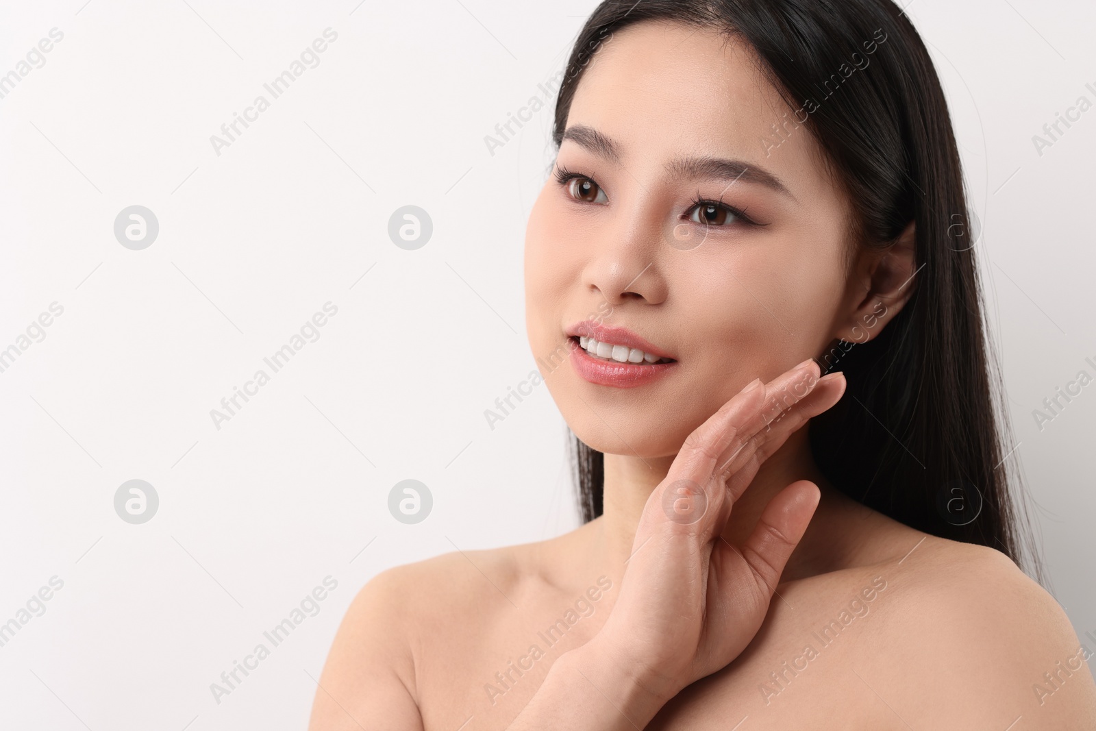 Photo of Portrait of beautiful woman on white background
