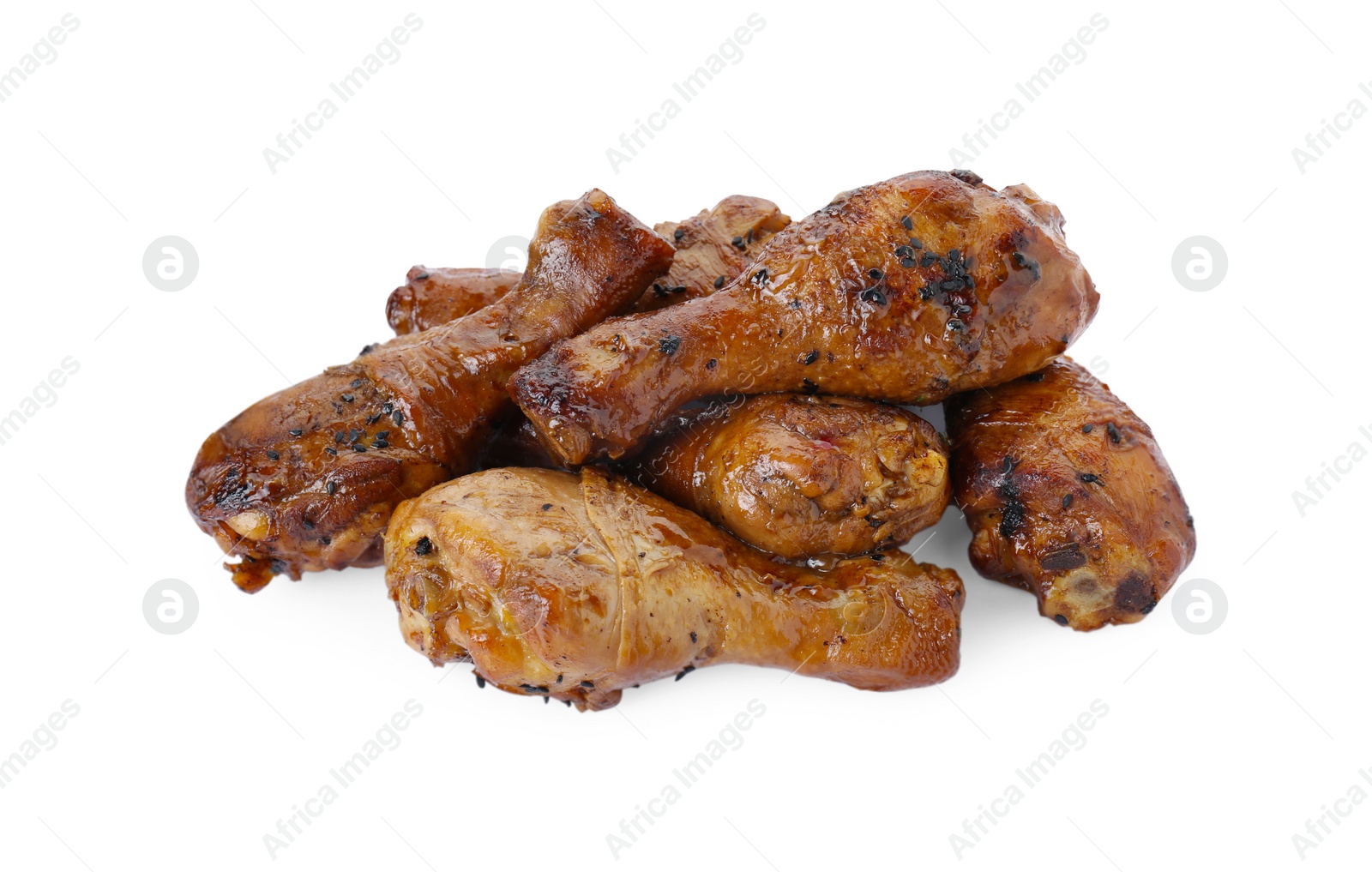 Photo of Pile of chicken legs glazed with soy sauce isolated on white