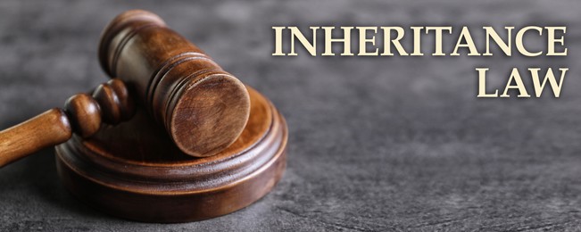 Phrase Inheritance law and wooden gavel on grey background, banner design