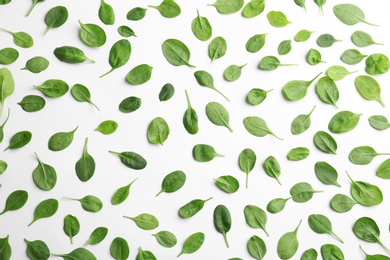 Photo of Fresh green leaves of healthy baby spinach on white background, top view