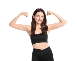 Photo of Happy young woman with slim body showing muscles on white background