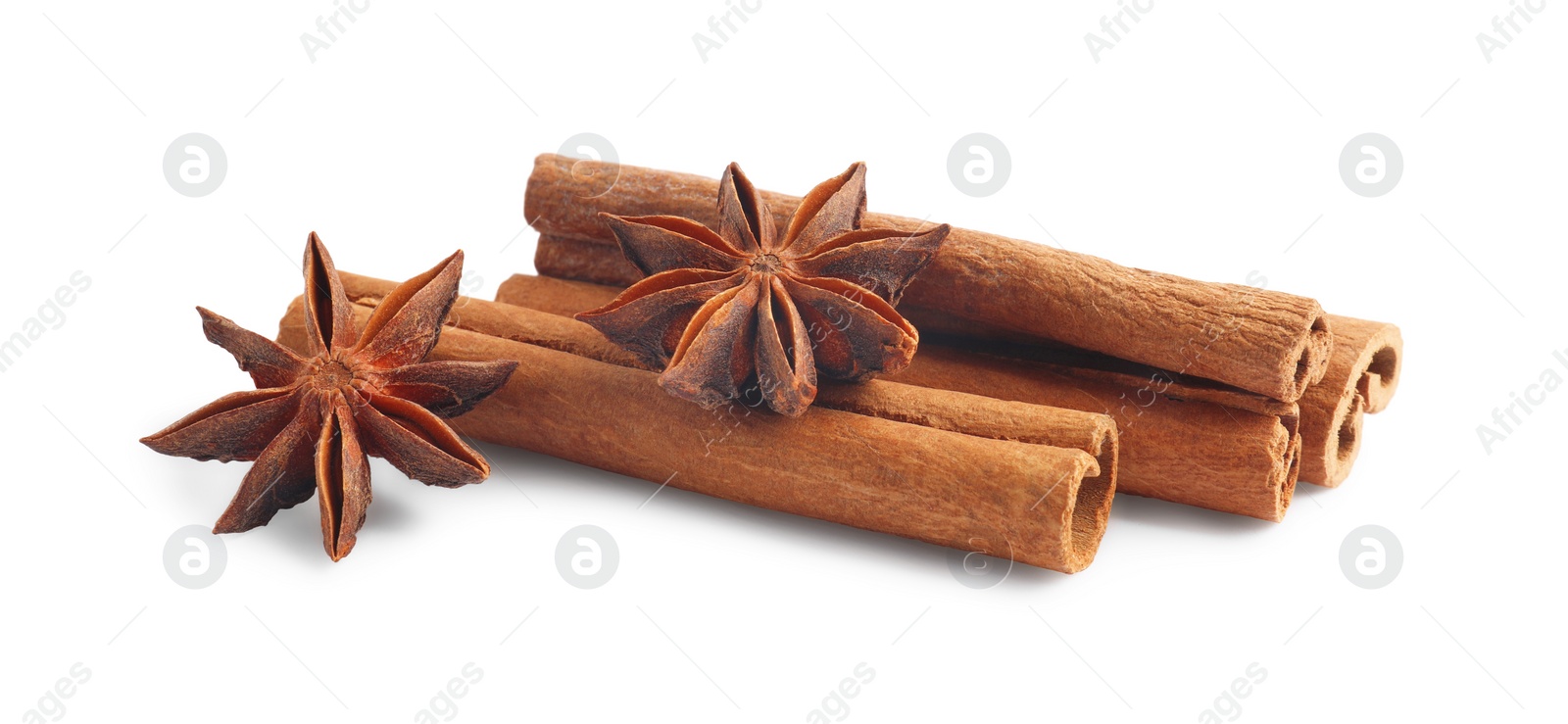 Photo of Aromatic cinnamon sticks and anise stars isolated on white