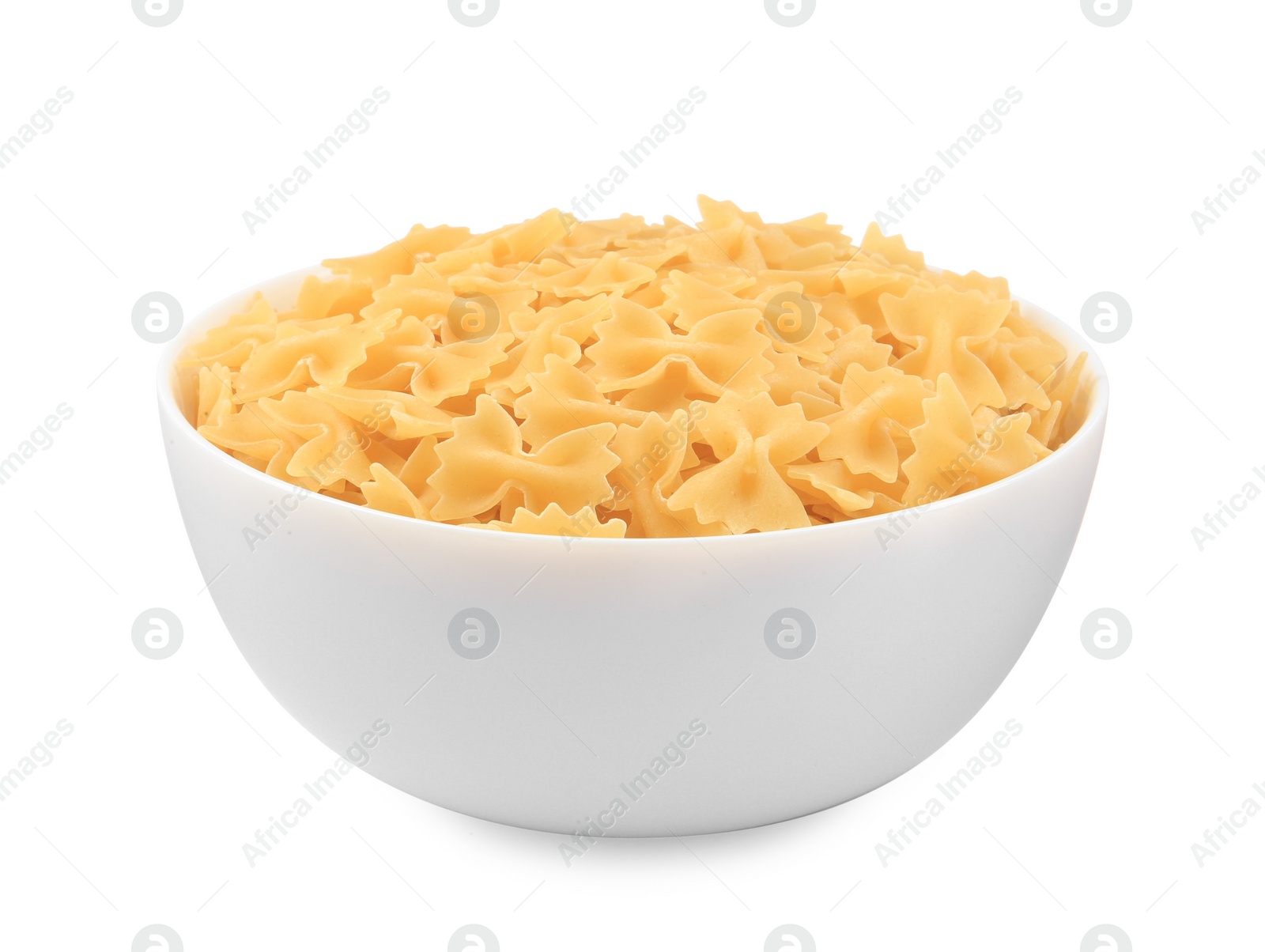 Photo of Raw farfalle pasta in bowl isolated on white