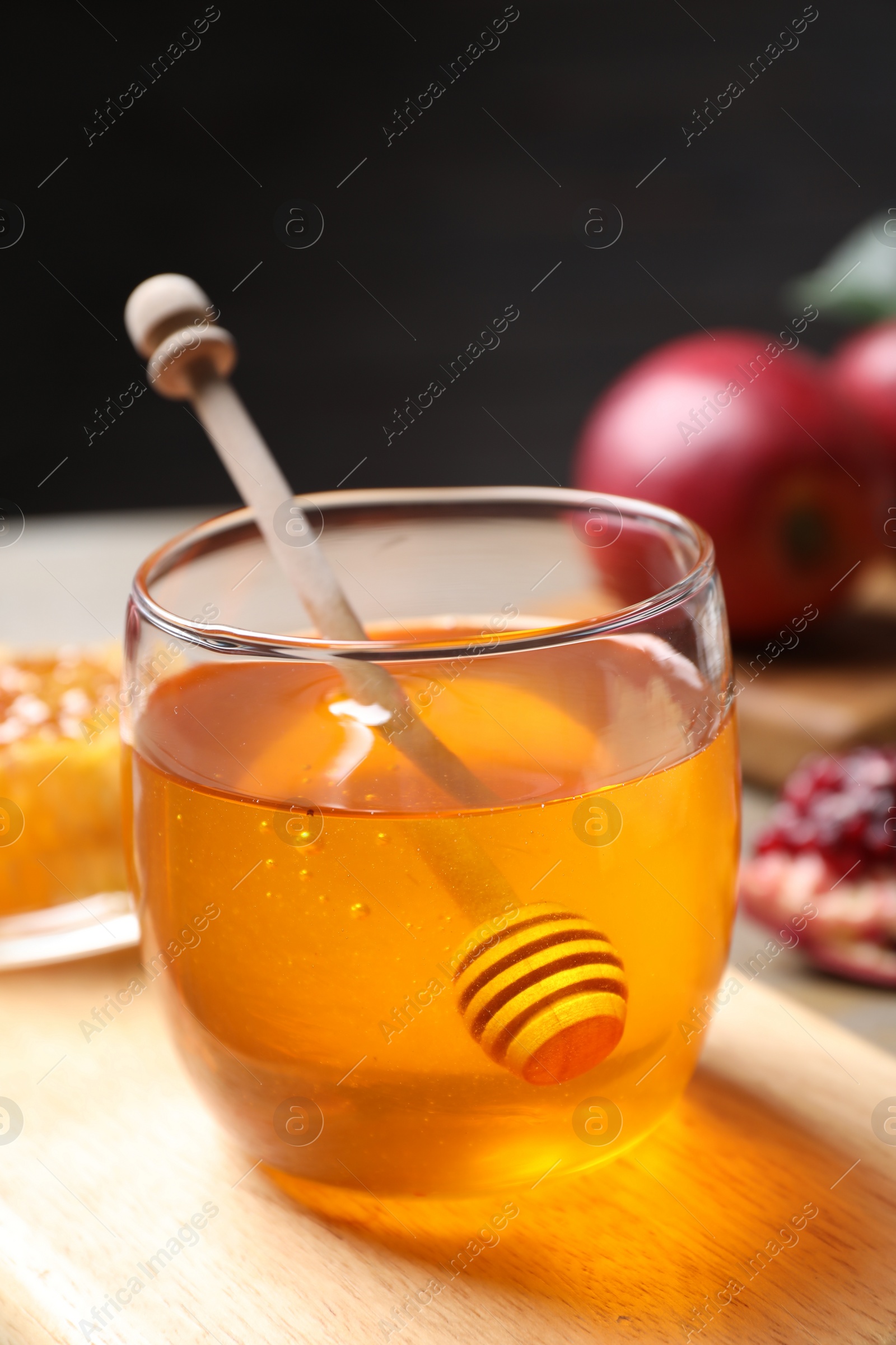 Photo of Honey, apples and pomegranate on table. Rosh Hashanah holiday