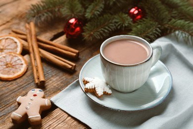 Delicious hot chocolate and Christmas decor on wooden table