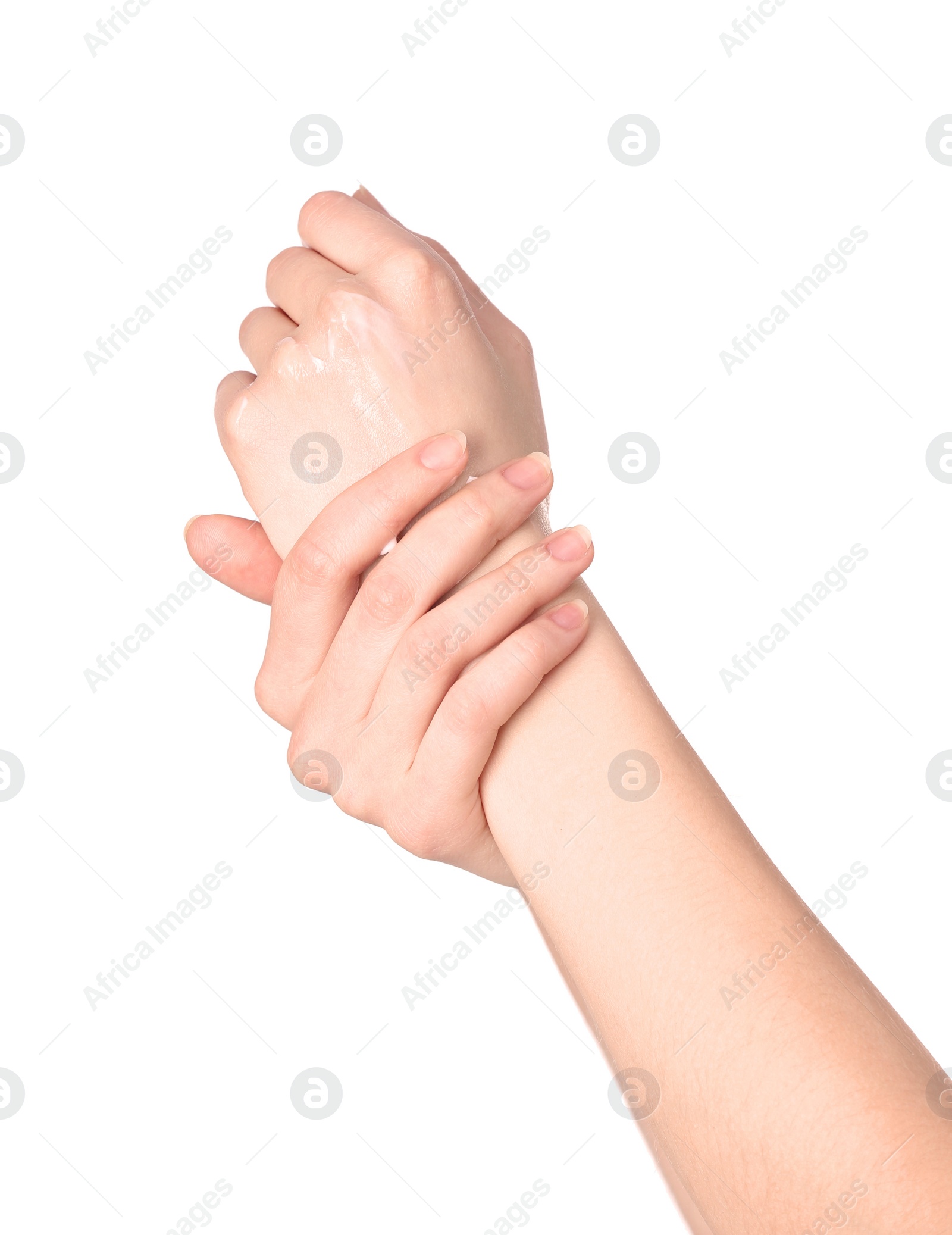 Photo of Young woman applying hand cream on white background