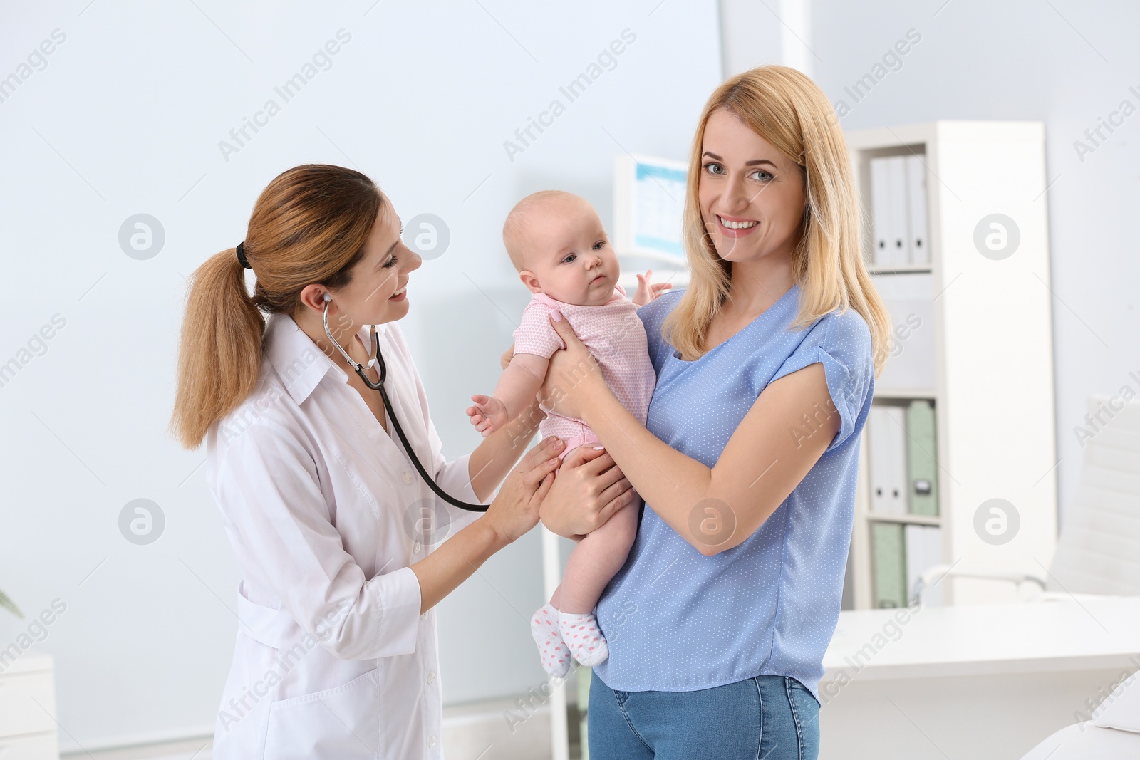 Photo of Woman with her baby visiting children's doctor in hospital